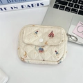 Detailed view of beige quilted coin purse with cute bear patterns and key ring accessory - Music Box Rabbit
