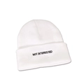 Detailed close-up of 'NOT INTERESTED' embroidery on a white folded knit beanie - M (56-58cm) / White