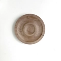 Detailed top view of a round walnut wood jewelry display tray for bracelets and beads - Walnut Wood Round