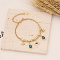 Bracciale a catena serpente dorata con ciondoli a occhio e pietre blu a goccia d'acqua - Bracciale A Catena Serpente Occhio Di Allah E Goccia D'Acqua