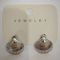 Silver shell-shaped stainless steel stud earrings displayed on a cream jewelry card - Steel Wide Shell (X442)