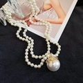 Close-up of double-layer pearl necklace with a starfish-shaped golden teardrop pendant - Double Layer with Large Pearl Pendant / White
