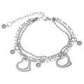 Detail of layered silver stainless steel bracelet featuring hollow heart pendants and beads - Triple Layer Hollow Heart Beads / Silver