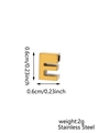Macro shot of 0.6cm gold stainless steel letter E pendant charm with zircon inlay - Letter-E / Steel