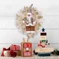 Festive Christmas wreath featuring Santa doll with gold and brown mesh decor on white wood - Gold Santa Claus