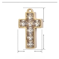 Macro shot of 31x17mm gold stainless steel cross pendant with zircon and sizing details - Zircon Cross / Gold