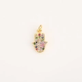 Macro detail of a golden Hand of Fatima pendant with vibrant multi-color zircon stones - Multicolor Hamsa Hand