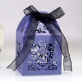 Macro shot of purple hollow heart gift box with elegant black organza ribbon detail - Sapphire Blue