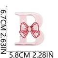 Detailed embroidery of pink letter B patch with bow, size 6.7cm x 5.8cm, white background - Pink Letter B
