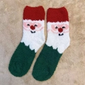 Cozy Santa Claus coral fleece Christmas sock in red white and green on beige rug - One Size / New Bearded Santa