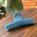 Detailed shot of a blue marble texture hair claw clip on a rustic wooden table surface - 11.5CM / Haze Blue