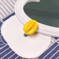 Bright yellow resin hair clip with black duckbill grip in creative fruit design - Yellow Starfruit