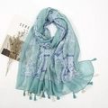 Detail of light green cotton linen scarf featuring blue floral prints and tassel edges - Light Green Fresh Geometric Floral (XB061)