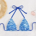 Blue and white zebra print halter bikini top with neck ties on a beach setup - Blue Zebra Print