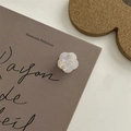 Iridescent white flower hair clip with pearl finish on a minimalist display card - Mini Flower Claw Clip