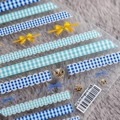 Detail of 5D embossed nail stickers featuring blue plaid and yellow bowknot designs - TS-385 Blueberry Girl