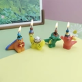 Colorful dinosaur birthday candles with party hats for creative cake decoration - Cake Dinosaur Candle
