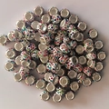 Close-up of multicolor crystal encrusted eyelet beads with large 5mm holes for DIY crafts - White with Mixed Rhinestone