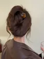 Detailed view of amber round beads on a U-shaped hairpin for elegant bun hair styling - Caramel Brown