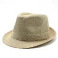Gros plan sur la texture en fibres tressées de ce chapeau de soleil unisexe élégant - M (56-58cm) / Beige