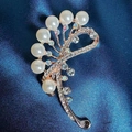 Elegant gold camellia brooch with white pearls and sparkling rhinestones on blue silk - Water Drop Brooch