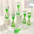 Panda themed liquid motion bubbler toy with green oil drops and miniature panda figures - Panda Hexagon Liquid Drip Ornament