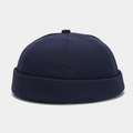 Detail of navy blue cotton docker hat showing the rolled brim and stitching on fabric - Adjustable / Navy Blue