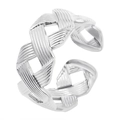 Macro detail of silver-toned braided weave pattern on adjustable open band ring - Silver