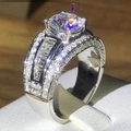 Luxurious wide silver ring with large round zircon and multi-row pave setting - US 6 / White Gold