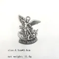 Macro view of Saint Michael metal pendant with detailed religious carving and antique finish - Antique Pewter