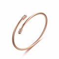 Elegant detailed view of a rose gold twisted cable open bangle with ribbed ball ends - Round Head Style / Rose Gold