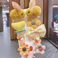 Bright yellow hair clips set for girls featuring plush rabbits and knitted flowers - Yellow Double Rabbit Set
