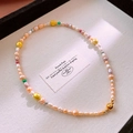 Close-up of colorful baroque pearl necklace with a polished gold spherical clasp - 10# Necklace-Gold-White-Pink