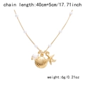 Detail of starfish and shell charms on golden necklace with pearls and size specs - Pearl Gold NC25Y0084