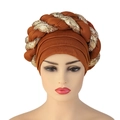 Detailed view of brown turban hat featuring a golden sequin braided trim and elastic fabric - Dark Brown