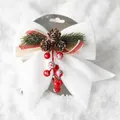 White Christmas bow with pine cones and red berries on a snowy background, 16.5x19.5cm - White Pine Cone Christmas Bow