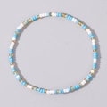 Minimalist beaded bracelet with light blue, white, and golden beads in a smooth finish - Sky Blue White Gold