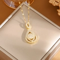 Elegant gold-tone titanium necklace featuring a teardrop pendant with white cubic zirconia - A0079 Gold