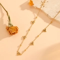 Gold-plated stainless steel heart necklace with cubic zirconia and bead chain on stone - Gold