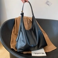 Minimalist black large-capacity hobo bag in sleek faux leather with adjustable strap - Black