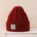 Detail of burgundy cable knit winter hat featuring a cute bear patch with Lucky text - 3-8 Years / Burgundy