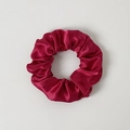Close-up of a red LED glowing scrunchie with a glossy satin finish on a white background - Burgundy