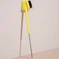 Dual-purpose yellow eyebrow and eyelash styling brush with a slender metal pointed tail - Yellow