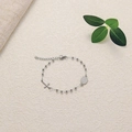 Detail of silver rosary bracelet with cross and Saint Benedict medal on natural background - Silver Steel Priest