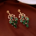 Detailed macro view of vintage gold-plated chandelier earrings with emerald marquise gems - 40# Silver Earring Post - Gold - Emerald Style Gem - Vintage Long Tassel