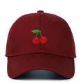 Close-up of premium cherry embroidery on dark red cotton twill baseball cap fabric - Adjustable / Burgundy
