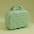 Mini valigia cosmetica rigida verde menta con motivi a fiocco e doppi manici robusti - verde chiaro