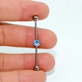 G23 titanium industrial barbell earring with a sky blue central gemstone and silver finish - Light Blue Flat Zirconia