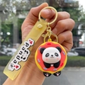 Detail of cute cartoon panda donut keychain with yellow silicone strap and metal ring - Cosplay Panda - Donut
