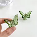 Mini matcha green butterfly hair claws made of translucent resin for styling - 80 Small Green (1pc)